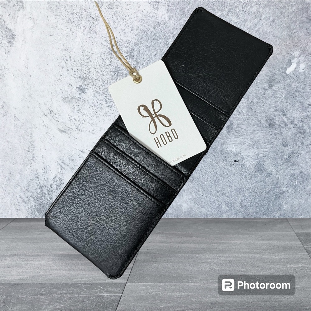Hobo men’s black leather Bifold wallet. Has window for license.